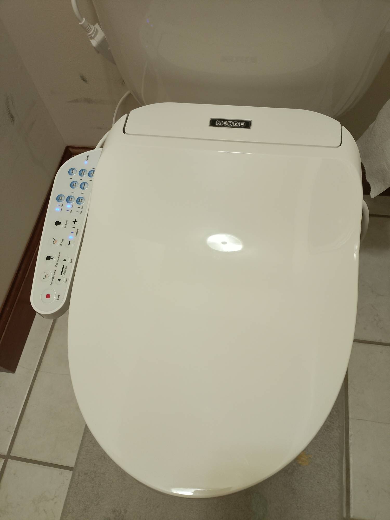 Fully installed KERDE P30B electronic bidet seat mounted on a toilet bowl