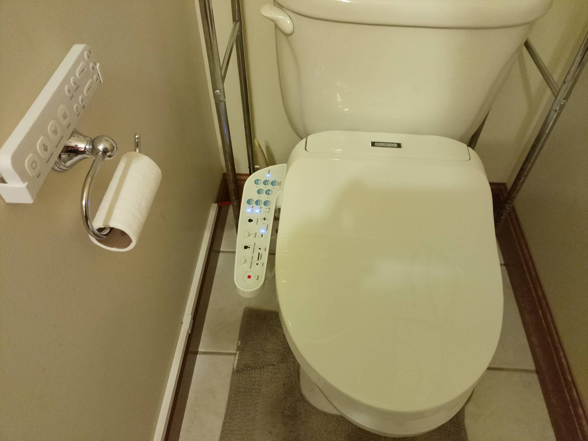 Second bidet seat installed on toilet in secondary bathroom